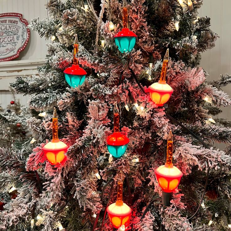 a christmas tree decorated with lights and ornaments