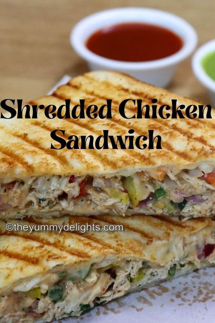 close-up of shredded chicken sandwich stacked on a board. Chicken Sandwich Filling, Chicken Mayonnaise, Shredded Chicken Sandwiches, Grilled Sandwich Recipe, Chicken Breast Sandwich, Easy Breakfast Sandwich, Chicken Sandwich Recipe, Pan Chicken Recipes, Healthy Sandwich Recipes