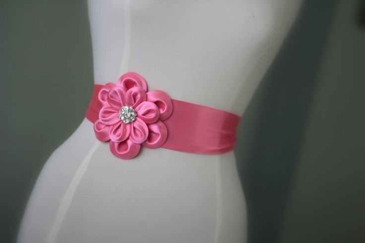 "An accessory to complement your beautiful wedding dress Made of satin fabric with flowers and belt made of satin. In the middle of the flower button is used the crystal. Flower size is approximately 5 \"dimensions. The belt length is approximately 80\"dimensions Flower fitted with lapel pins. Then, a flower can be used as a separate lapel pin. Please feel free to contact for questions and requests. PACKAGE ARE SENT BY FAST SHIPPING COMPANY WITHIN 3 TO 4 BUSINESS DAYS, TO UNITED STATES, TO CANAD Pink Elegant Sash For Formal Occasions, Pink Bridal Belt With Sashes For Party, Elegant Fitted Pink Sashes, Pink Sashes Bridal Belt For Wedding, Elegant Pink Bridal Belt With Sashes, Satin Ribbon Bridal Belt For Parties, Elegant Bridal Belt With Flower Decoration, Elegant Sashes With Handmade Flowers For Party, Elegant Handmade Flower Sashes For Party