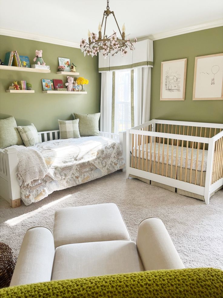 a baby's room with a crib, bed, and couch in it