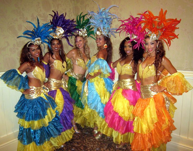 a group of women dressed in colorful costumes