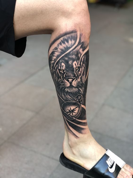 a man with a tiger tattoo on his leg