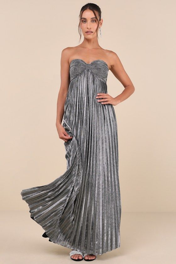 Cheers to a glam and gorgeous night out in the Lulus Glittering Luxury Silver Lurex Pleated Strapless Maxi Dress! Lightweight woven fabric boasts sparkling, silver Lurex threading as it shapes a sweetheart neckline (with hidden no-slip strips) and a strapless, plisse-textured bodice with a cinched, bow-like design. High empire waist tops a cascading, pleated A-line skirt that falls to a sweeping maxi hem. Hidden back zipper/clasp. Fit: This garment fits true to size. Length: Floor length. Size m Silver Dress Bridesmaid, Silver Maxi Dress, Silver Bridesmaid Dresses, Empire Waist Tops, Shimmer Dress, Strapless Maxi, Dress Inspo, Strapless Maxi Dress, Pleated Maxi Dress