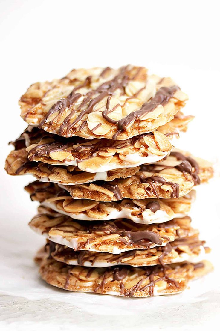 a stack of cookies covered in chocolate and marshmallows