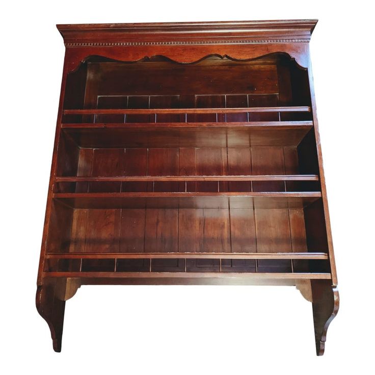 an old wooden bookcase is shown against a white background