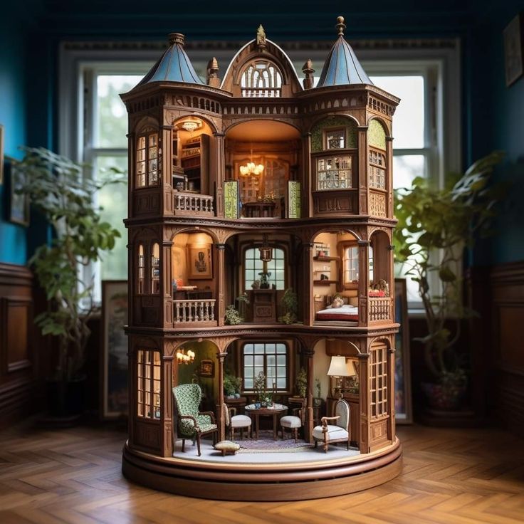 a doll house is shown in the middle of a room with wooden floors and blue walls