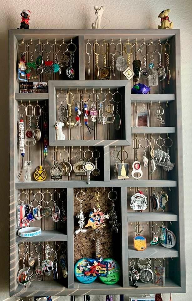 a shelf filled with lots of different types of key chains and other things on it