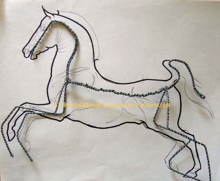 a drawing of a horse is shown on a piece of white paper with black thread