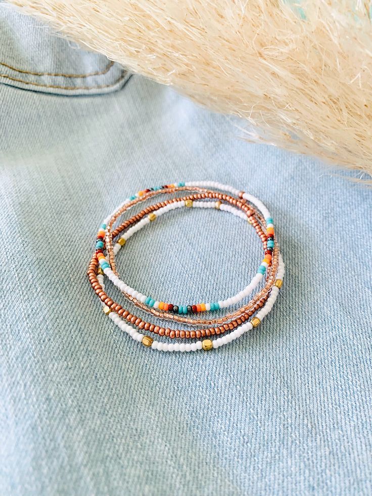 This beachy bracelet set is so dainty and would make a nice gift. Stack these together, with other bracelets, or wear them by themselves! They are perfect for everyday wear! ∙ ∙ ∙ ∙ ∙ ∙ ∙ ∙ ∙ ∙ ∙ ∙ ◆ MATERIALS ◆ * High-Quality Beading Elastic * Seed Beads of Various Colors ∙ ∙ ∙ ∙ ∙ ∙ ∙ ∙ ∙ ∙ ∙ ∙ ◆ SIZES ◆ This bracelet set is made to order so you can order it in whatever size you need. If you need a custom size please let me know. ∙ ∙ ∙ ∙ ∙ ∙ ∙ ∙ ∙ ∙ ∙ ∙ ◆ FINDING THE RIGHT SIZE ◆ You can find White Bracelet With Tiny Beads For Festival, White Bohemian Stretch Bracelet For Friendship, White Bohemian Wrap Bracelet With Tiny Beads, Bohemian White Wrap Bracelet With Tiny Beads, White Bohemian Stackable Bracelets, Bohemian White Stackable Bracelets, Bohemian White Tiny Beads Wrap Bracelet, Bohemian Stackable Beaded Bracelets For Friendship, White Beaded Bangle Bracelets For Festival