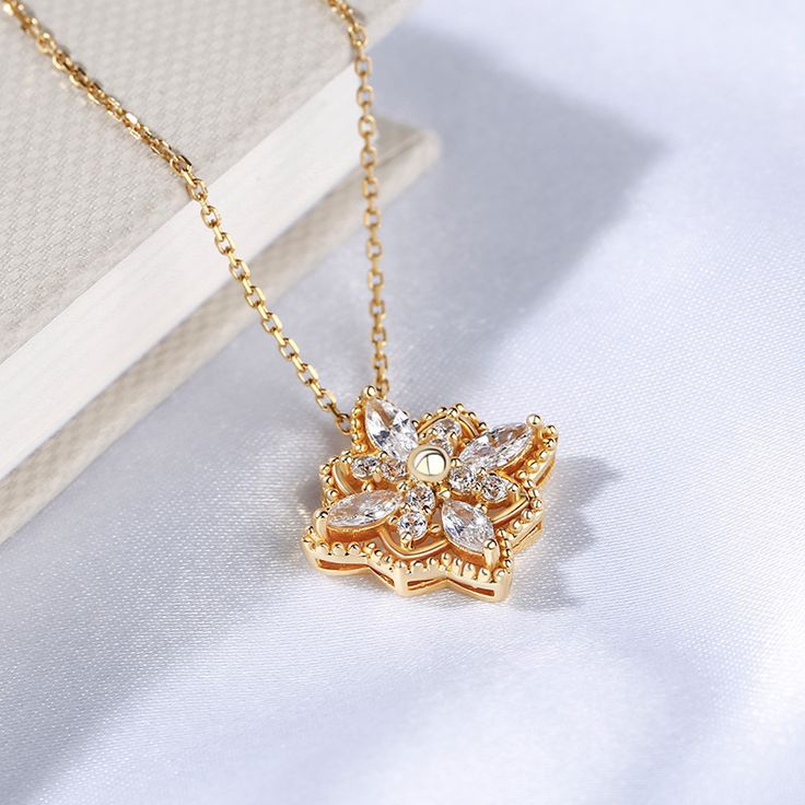 Treat her to a beautiful floral necklace that never fades. This elegant necklace offers a delicate, feminine appearance that she is certain to appreciate. Crafted in sterling silver, this necklece showcases a unique floral design, and the milgrain detailing along the pendant's edge adds depth and dimension to this elegant design. Wherever she goes, this necklace is a sweet reminder of your love and care next to her heart.Carat Weight: 2.04 ctStone Size: 2,3*6 mmStone Type: Jeulia® StoneNumber of Elegant 14k Gold Milgrain Jewelry, Intricate Yellow Gold Plated Necklace, Exquisite Yellow Gold Flower Shaped Necklace, Engraved Yellow Gold Flower-shaped Necklace, Exquisite Yellow Gold Flower-shaped Jewelry, Silver Jewelry Set, Delicate Feminine, Silver Jewellery Sets, Elegant Necklace