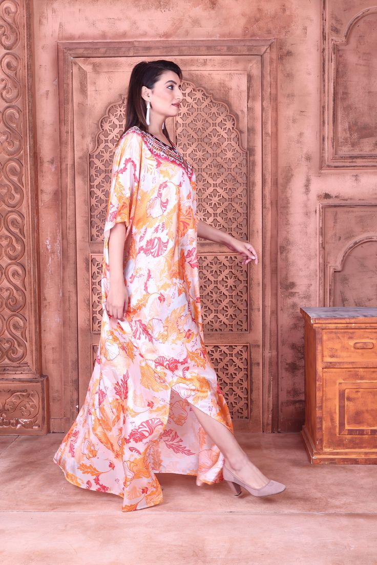 Appealing Tapestry Print Maxi long Kaftan with exquisite embellishments of beads Luxury resort wear kaftan Look graceful with this appealing Abstract print kaftan with this unique Pink print you get a capturing stylish appearance as it fits every kind of body line with exquisiteness. The ornamental beaded neckline is an attractive addition to this kaftan. Wearing it on any occasion, you look graceful and tempting all the way. - hand-applied: crystals - fabrication: Silk - embellishment: Crystals Elegant Straight Kurta Kaftan For Summer, Festive Floral Print Maxi Kaftan, Bollywood Style Multicolor Straight Kurta Kaftan, Festive Silk Kaftan With Digital Print, Festive Bohemian Kaftan With Floral Print, Festive Printed Dresses For Vacation, Bollywood Style Silk Maxi Kaftan, Festive Vacation Dresses With Printed Motifs, Floor-length Floral Print Kaftan For Eid