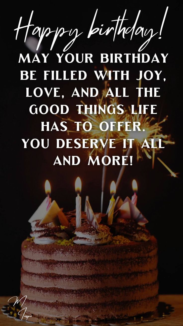 a birthday cake with lit candles on it that says happy birthday may your birthday be filled with joy, love and all the good things life has to offer