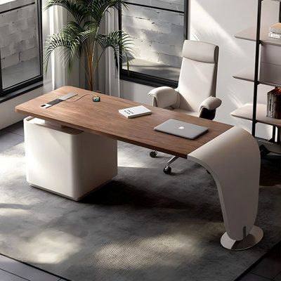 an office desk with a laptop on it in front of a window and a potted plant