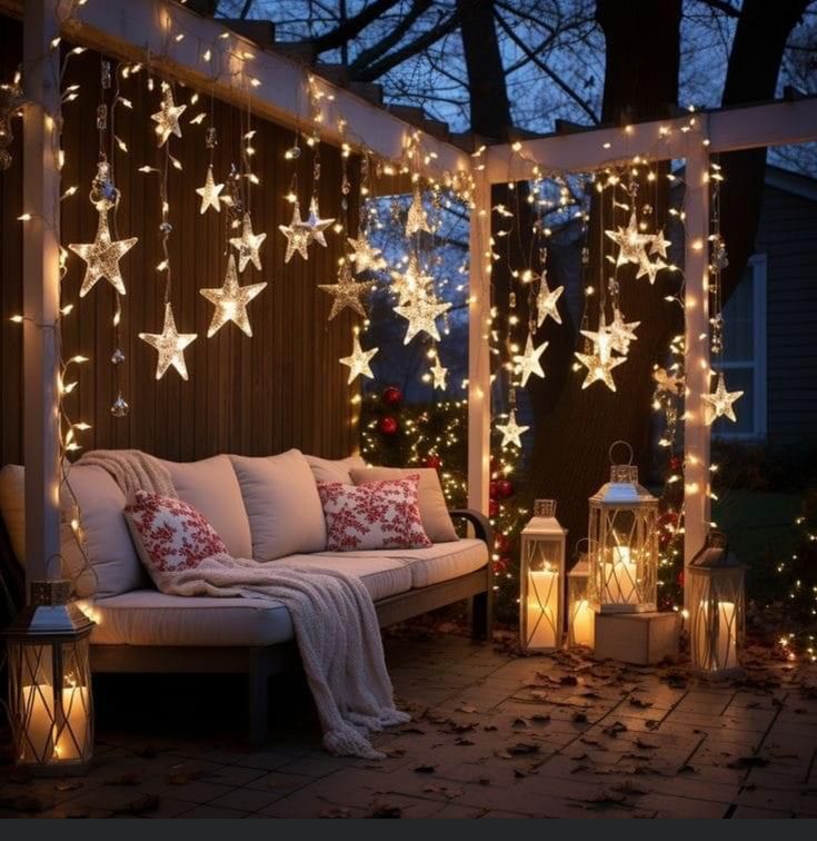 a patio covered in christmas lights and stars