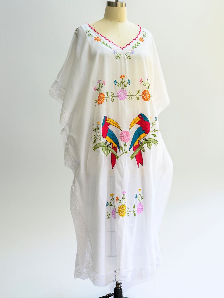 Vintage embroidered kaftan from the 1970s. Perfect coverup for summer beach or pool days. In excellent condition. Pam Royale. BOHO chic. Gorgeous lace trim. Size: Will fit large, extra large Length: 48 inches Pit to pit: 30 inches Pockets: None Lining: None Fasteneres: None Color: White with embroidery Fabric: Cotton Care: Machine wash in cool water, hang to dry Condition: Excellent Embroidered Kaftan For Beach Cover-up, Summer Beach Cover-up Kaftan With Kimono Sleeves, Long Embroidered Cover-up For Vacation, Long Embroidered Kaftan For Beach Season, Long Embroidered Beach Kaftan, Embroidered Long Kaftan For Beach, Embroidered Beachwear Cover-up For Beach Season, Beachwear Unlined Kaftan For Beach, Bohemian Unlined Cover-up For Beach Season