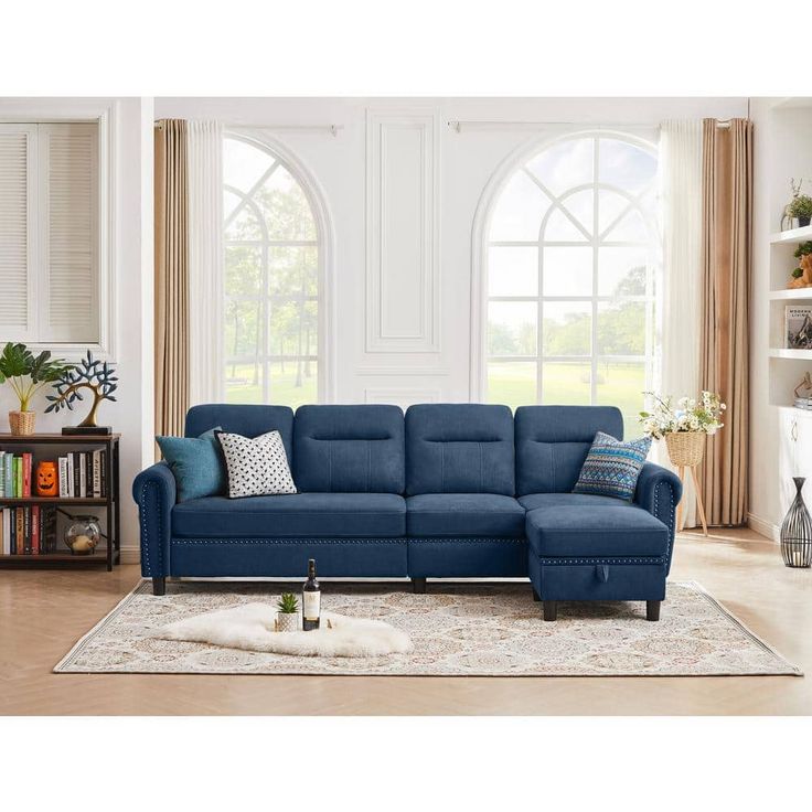 a living room with a blue sectional couch