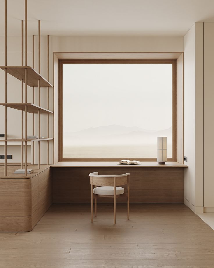 an empty room with shelves and a desk in front of a large window that looks out onto the ocean