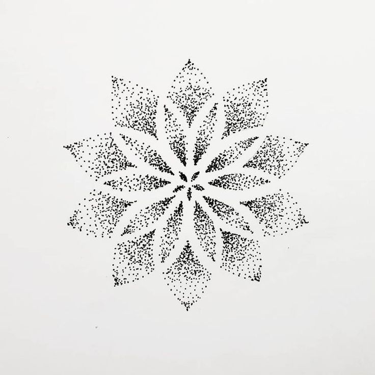 a black and white photo of a snowflake