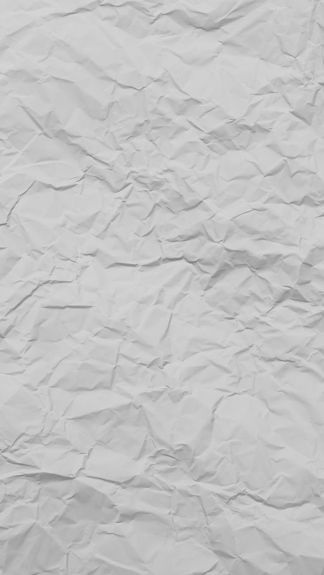 an image of white paper textured with crinkled lines on the bottom corner