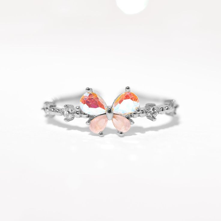 Transform your world with the Kaleidoscope Butterfly Adjustable Ring, a playful piece that adds a touch of magic to your everyday style. Delicately crafted to reflect an array of colors, this petite and cute ring is reminiscent of a rainbow fluttering over your head - it's easy to get lost in its beauty! 18k gold plated, 18k rose gold plated, or rhodium plated over brass with a protective coating Cubic zirconia stones Approx 8mm width Size 6, slightly adjustable Shop the entire In the Garden Col Cute Multicolor Rings As Gifts, Cute Multicolor Rings For Gift, Cute Multicolor Rings For Gifts, Multicolor Flower Ring As Gift, Multicolor Flower Ring Gift, Multicolor Open Crystal Ring As Gift, Multicolor Open Ring Crystal Ring Gift, Multicolor Open Ring Stackable Rings As Gift, Adjustable Multicolor Crystal Ring Gift