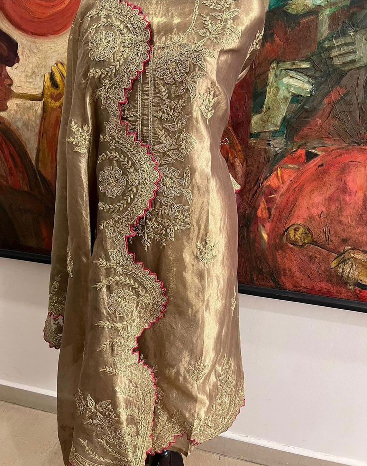 Item Overview ATHARVA Hand Woven Pure Tissue Silk Salwar Kameez/Aari Dori Embroidery/Gold Tissue/Heirloom Worthy/Custom Stitch Unstitch/Wedding/Plazzo/Gift/ Designer Wear Dno. SK2007 Fabric:  * Shirt: Pure Tissue Silk - Hand Embroidery/ 2.5 Mts Beautiful Aari Dori Work * Dupatta: Pure Tissue Silk - Hand Embroidery/ 2.5 Mts Beautiful Aari Dori Work/Elegant/Tassels/ * Bottom: Pure Tissue Silk 2.5 Mts. Excusive Hand Embroidered Party Wear Punjabi Suit. Customization: * Fabrics Customization: Designs Can be made in different Fabrics. *Color Customization: Designs Can be made in different Colors *Stitching Customization: 1. Salwar Kameez  2. Patiala Salwar Kameez  3. Churridar  4. Tunic Pants  5. Anarkali (Extra Charge) 6. Maxie (Extra Charge) 7. Plazzo Pants 8. Embroidered Pants or Salwars 9. Luxury Katan Silk Salwar Kameez With Dori Work, Transitional Tissue Silk Kurta With Zari Work, Festive Kurta With Resham Embroidery On Tissue Silk, Tissue Silk Straight Kurta For Reception, Straight Tissue Silk Kurta For Reception, Embroidered Straight Kurta In Tissue Silk, Festive Tissue Silk Kurta With Zari Work, Embroidered Tissue Silk Straight Kurta, Traditional Wear Tissue Silk Straight Kurta For Reception