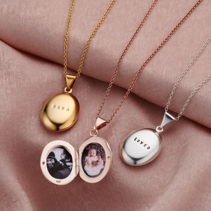 This classic style locket necklace is made from beautiful 925 Sterling Silver. Suspended from a dainty silver trace chain, the locket is double-sided inside so you can enclose up to two photos, one on each side. Our jewellers can also personalise your locket with a short name or date, making your locket truly unique. For an extra special touch, our jewellers can also plate your necklace in either 18ct Yellow Gold or 18ct Rose Gold. Choose from black and clear letter finish. We can print your cho