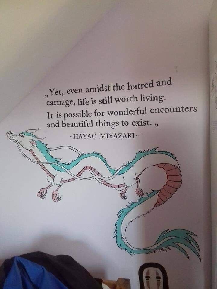 a bedroom with a dragon painted on the wall and a quote above it that says, yet even amidst the harted and carmage life is still worth living