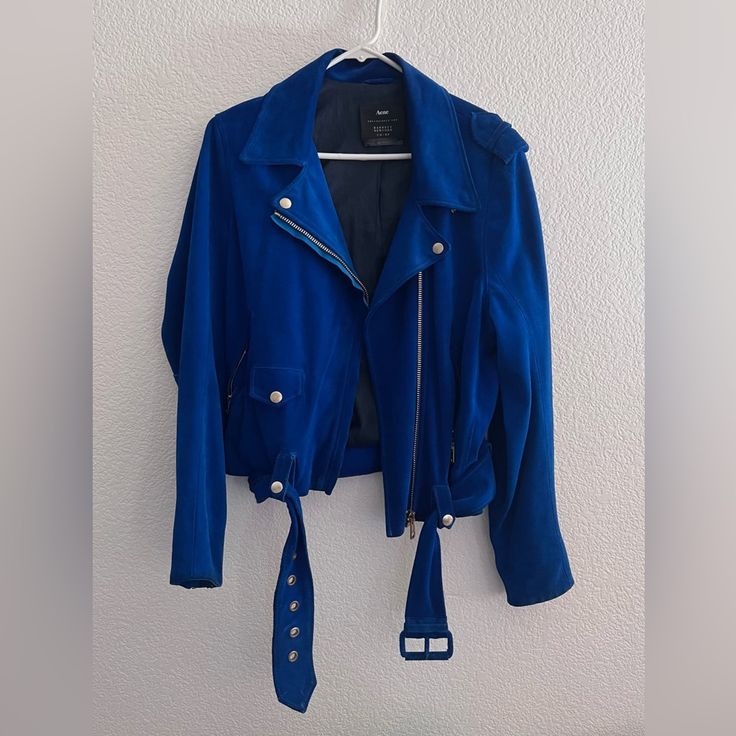 Acne Moto Jacket, Blue Suede, Size M. Used But In Good Condition. I Few Spots, Tiny Hole By Belt, Wear And Tear On Belt And Sleeves (As Shown In Photos). Blue Trendy Leather Jacket For Spring, Trendy Blue Biker Jacket With Long Sleeves, Trendy Blue Long Sleeve Biker Jacket, Casual Blue Long Sleeve Biker Jacket, Fitted Blue Biker Jacket With Long Sleeves, Casual Fitted Blue Biker Jacket, Blue Moto Outerwear With Long Sleeves, Blue Biker Jacket For Spring, Spring Blue Biker Jacket