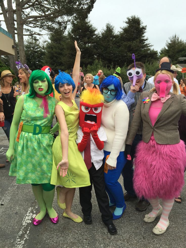 group of people in costumes posing for the camera