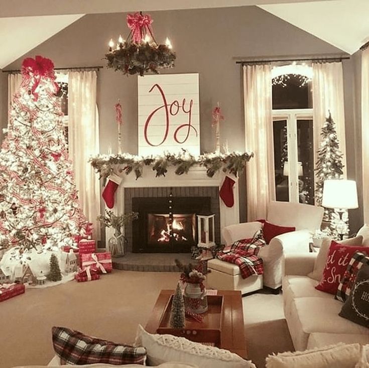 the living room is decorated for christmas with red and white decorations