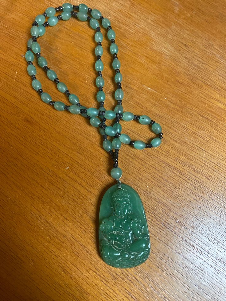 "Beautiful Vintage Chinese Carved stone, likely Jade, Hard Stone Buddha Pendant Bead Necklace. The pendant measures 2.25\"high x 1 1/4\" wide x 3/8\" in depth and the beaded becklace is 26\" and slips over the head. Very, very good condition. No chips, cracks or repairs" Spiritual Hand-strung Jade Beaded Necklace, Traditional Jade Beaded Necklaces With Gemstone Beads, Spiritual Jade Jewelry With 108 Beads, Spiritual Jade Beaded Necklaces For Meditation, Traditional Hand-strung Jade Beaded Necklace, Jade Amulet Jewelry For Meditation, Traditional Jade Necklace With Gemstone Beads, Spiritual Jade Beaded Pendant Necklace, Artisan Jade Jewelry For Meditation