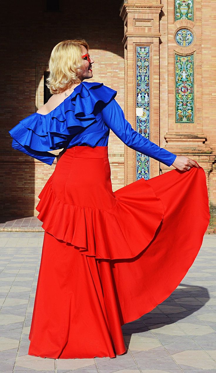 Red ruffled cotton skirt, cropped in front and with a long flared tail. Stylish, playful, versatile and fun, this red skirt will add a touch of Andalusian feeling to your wardrobe. A beautiful bouquet of red on flamenco rhythms, this playful ruffled skirt conquers the streets! High waisted, flared and extremely comfortable, this red skirt will definitely enliven your summer wardrobe! *new piece from the fresh ANDALUSIA collection Material: 95% cotton, 5% elastane Care instructions: Wash at 30 de Red Long Skirt, Flamenco Skirt, Long Maxi Skirt, Skirt High Waist, High Waist Skirt, Red Skirt, Long Skirts For Women, Long Maxi Skirts, Skirt Long