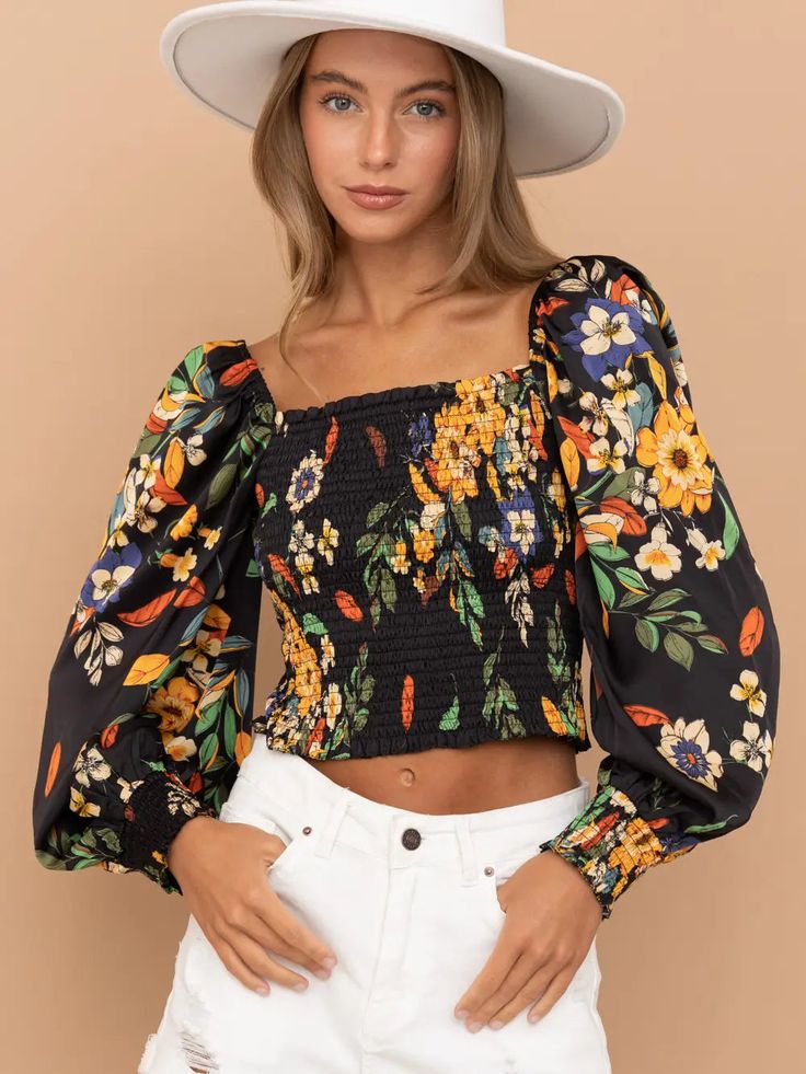 Color: Black with Multi Flowers Long Sleeve Cropped Blouse Tropical Floral Pattern Smocked Bodice and Sleeves Square Neckline Puff Long Sleeves 100% Polyester Summer Multicolor Blouse With Smocked Cuffs, Multicolor Tops With Elastic Sleeves For Spring, Spring Top With Smocked Cuffs And Square Neck, Spring Square Neck Top With Smocked Cuffs, Casual Fitted Smocked Top With Blouson Sleeves, Fitted Casual Smocked Top With Blouson Sleeves, Chic Black Peasant Top For Spring, Black Blouse With Smocked Back For Fall, Black Lantern Sleeve Top For Summer