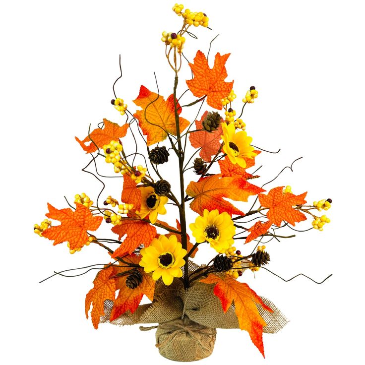 a vase filled with yellow and orange flowers on top of a white table next to a burlap bag