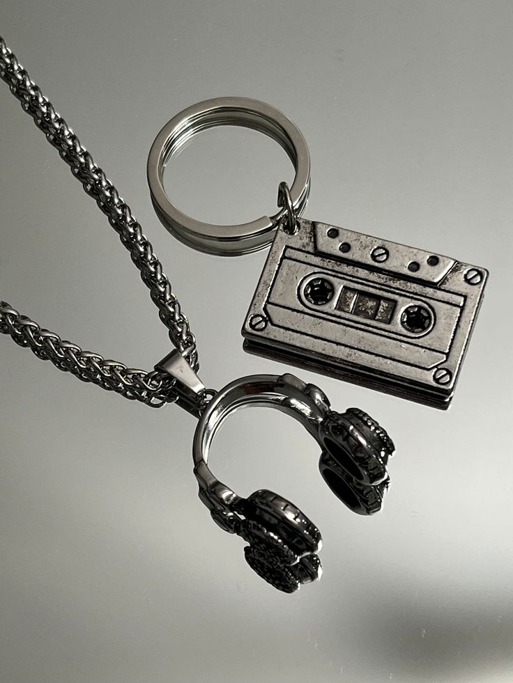 "The ultimate present for him: A sleek Stainless Steel Vintage Cassette Keychain. Headphone pendant option available.  Functional, Fashionable & Durable Men's Stainless Steel. Stainless Steel Vintage Cassette Keychain - Perfect Gift for the DJ, Musician, or Music Lover in your life. Amazing detail. Length 1.5\" Width 3/4\" Whether you are buying for yourself or the man/woman in your life, this is going to be the piece that you/he/she will love for years to come!  K E E P * I N * T O U CH https:/ Gifts For Musicians Boyfriend, Cool Key Chains, Headphone Keychain, Grunge Gifts Ideas, Masc Jewelry, Music Related Gifts, Things I Want To Buy, Manly Gifts, Keychain Music