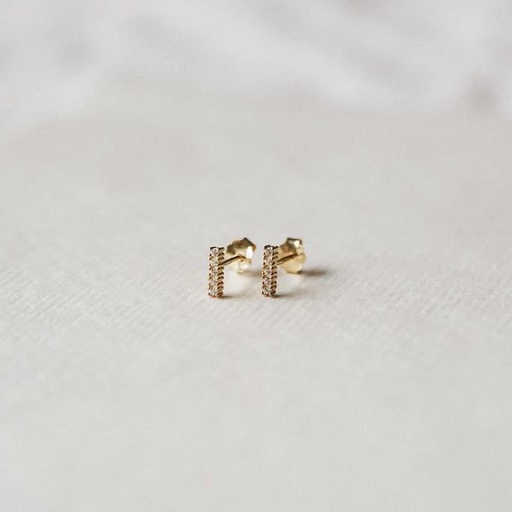 Pretty & simple stud earrings adorned with little cubic zirconia stones — perfect for your everyday.•  14k gold plating over sterling silver (hypoallergenic & nickel-free)•  Matching post backing•  Measures about 7mm long•  Ships as a pair (2 earrings total)Every order comes nicely packaged, ready for gift-giving! Please note that multiple items in the same order will be combined into one gift box. If the items are meant for separate individuals, please let me know.Shorter version availa Jewelry Necklace Simple, Simple Stud Earrings, 2 Earrings, Geometric Studs, Minimalist Studs, Tiny Studs, Tiny Stud Earrings, Small Earrings Studs, Minimal Jewelry