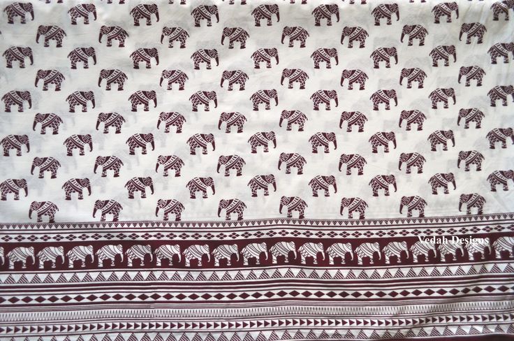 an elephant print fabric with red and white stripes