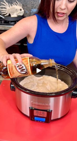 a woman pouring sauce into an electric pressure cooker on top of a red counter