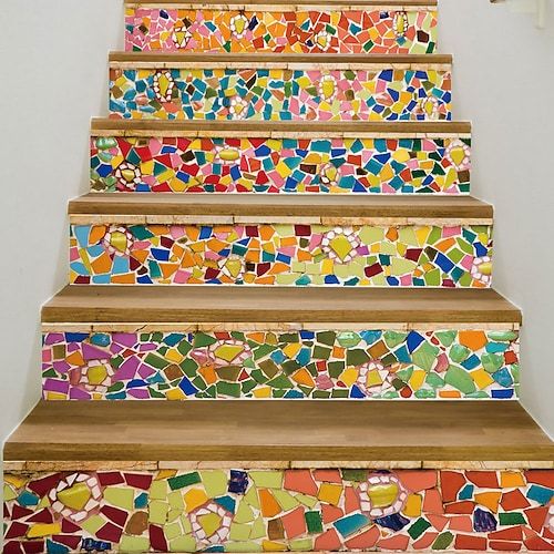 the stairs are decorated with multicolored tiles