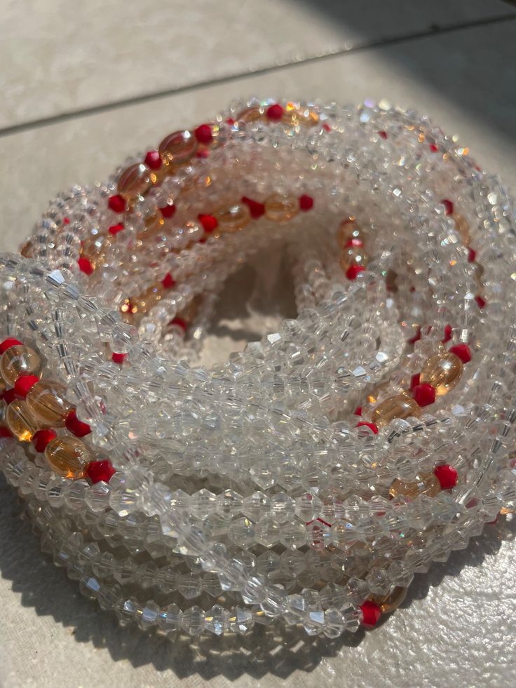 Elastic Waist Bead "Aboisso" crafted with luminous white glass crystal seed beads and adorned with subtle accents of passionate red crystal seed beads. This elastic waist bead not only epitomizes purity but also infuses a touch of fiery elegance, offering a comfortable and adjustable fit that transcends beauty and symbolism. 🌟 White Glass Crystal Seed Beads - Ethereal Radiance: Aboisso is adorned with a symphony of radiant white glass crystal seed beads, symbolizing purity and ethereal radiance Red Crystals, Glass Crystal, White Glass, Crystal Glass, Seed Beads, Elastic Waist, Elastic, Beads, Crystals