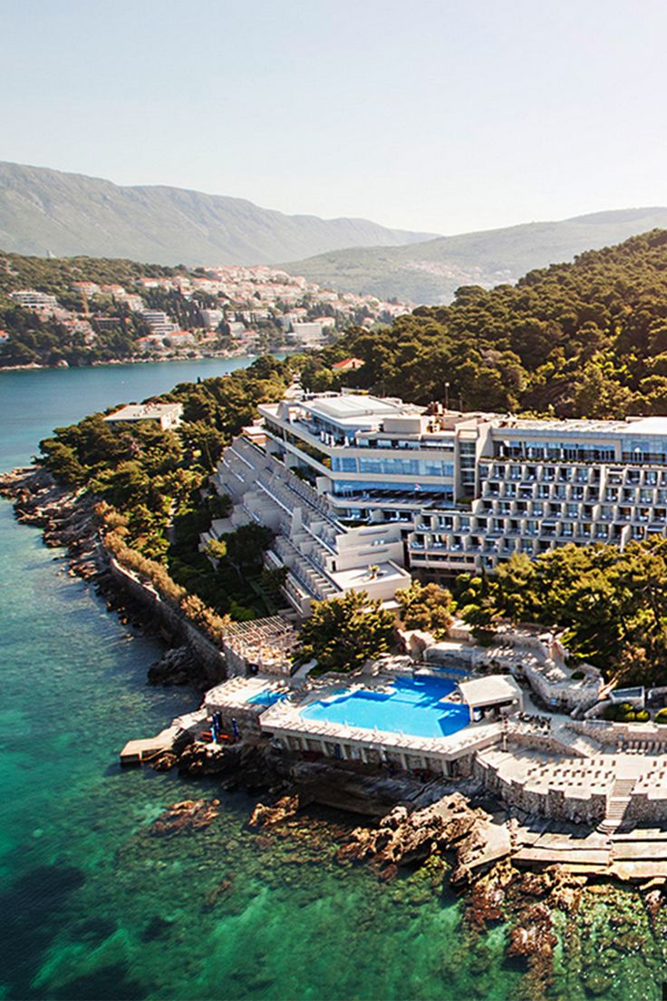 an aerial view of the resort and surrounding water