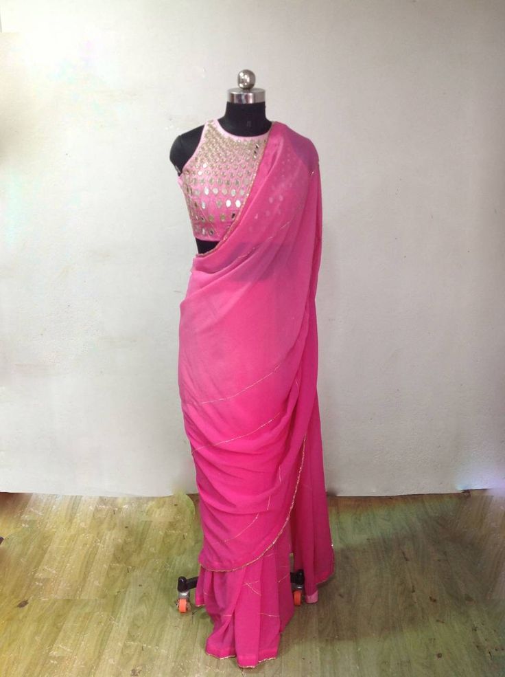 Graded pink ( light to dark) georgette embroidery saree with beautiful zardosi embroidery lines. Blouse is available as a seperate listing. The saree can be made in other colors as well Blouse: https://www.etsy.com/listing/957833251/custom-fit-graded-pink-mirror-work Festive Pink Pre-draped Saree With Mirror Work, Festive Pink Pre-draped Saree With Dori Work, Pink Chinon Sharara With Cutdana Detail, Pink Chinon Pre-draped Saree For Navratri, Designer Pink Pre-draped Saree With Zari Work, Pink Party Wear Choli With Cutdana, Pink Saree With Gota Work, Pink Dupatta With Cutdana For Party, Pink Cutdana Dupatta For Party