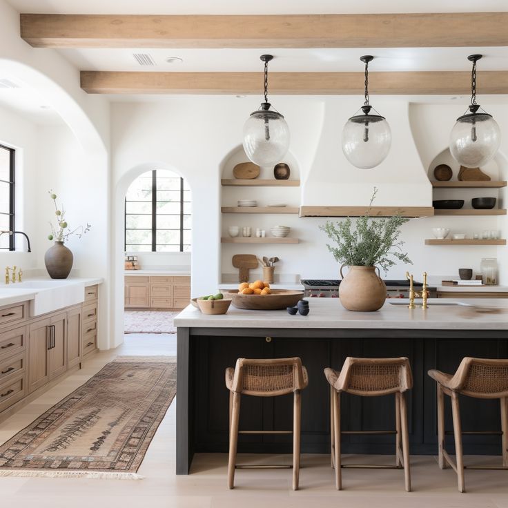 a kitchen with an island and two chairs in front of the counter top, surrounded by open shelves