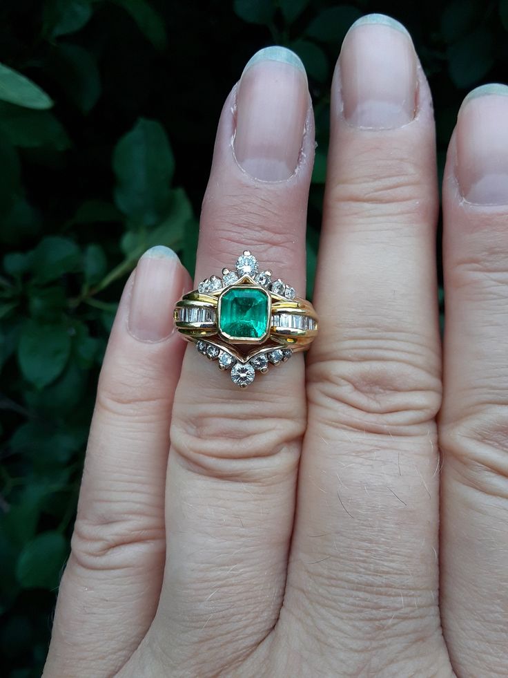 Beautiful 18k Yellow Gold, Approximately 1ct Cushion Cut Colombian Emerald, Diamond Baguette ring.. all sales are final. Weight is 5.5 Grams. Size 7 3/4.. Very Good Pre Owned Vintage Condition.. Ring Guard is NOT INCLUDED, just to show some ideas.. some pics ENLARGED to see details. Antique Box for Display only. Timeless Baguette Cut Emerald Ring For Wedding, Timeless Baguette Cut Emerald Wedding Ring, Luxury Hallmarked Emerald Wedding Ring, Princess Cut Diamond Emerald Ring For Wedding, Wedding Emerald Ring With Princess Cut Diamond, Princess Cut Emerald Ring For Wedding, Timeless Baguette Cut Emerald Ring For Anniversary, Timeless Emerald Ring With Diamond Accents For Wedding, Anniversary Rings With Baguette And Asscher Cut Diamonds