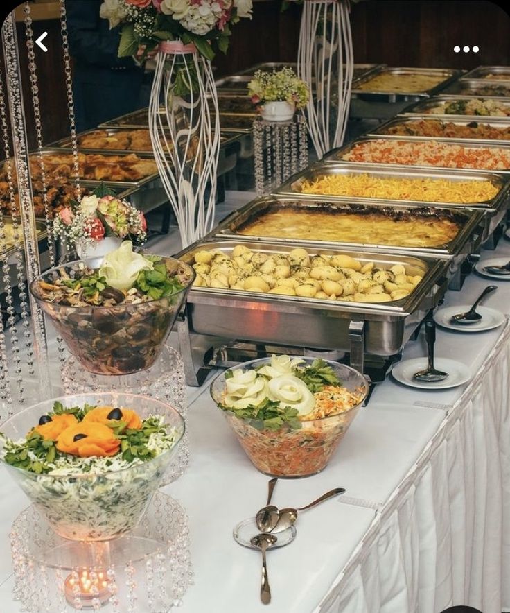 a buffet table filled with lots of food