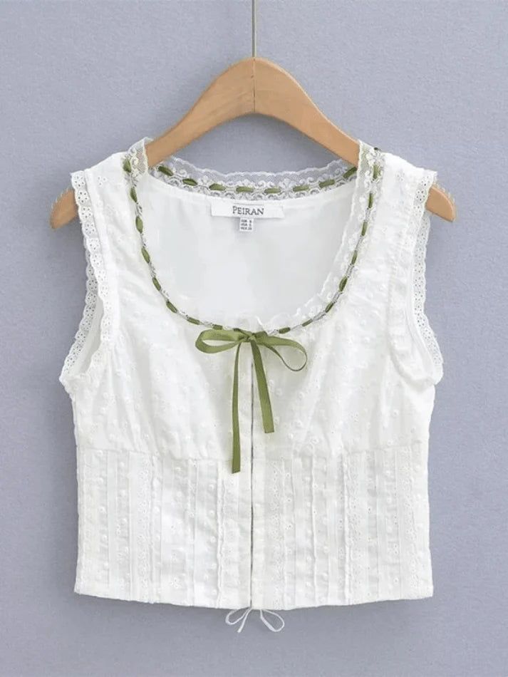 ⚡Buy 2023 Broderie Lace White Cropped Tank Top White S under $35.00 in Tops&Tees at AnotherChill.com Online. Style: Casual/Street/Y2K/Sexy/Sweet/Vintage. Fabric Content: Polyester Blend. Fit Type: Slim fit. Neckline: Crew Neck. Sleeve Length: Sleeveless. : Step up your fashion game with this adorable lace-up cropped tank top. Featuring a satin tie detail and a back criss-cross lace-up design, it's the perfect combination of cute and sexy. The eye-hook fasten on the front adds an extra touch of c Cheap Feminine Tops For Layering, Fest Outfits, White Crop Top Tank, Lace Trim Blouse, Vest Crop Top, Moda Vintage, Street Outfit, Mode Inspo, 가을 패션