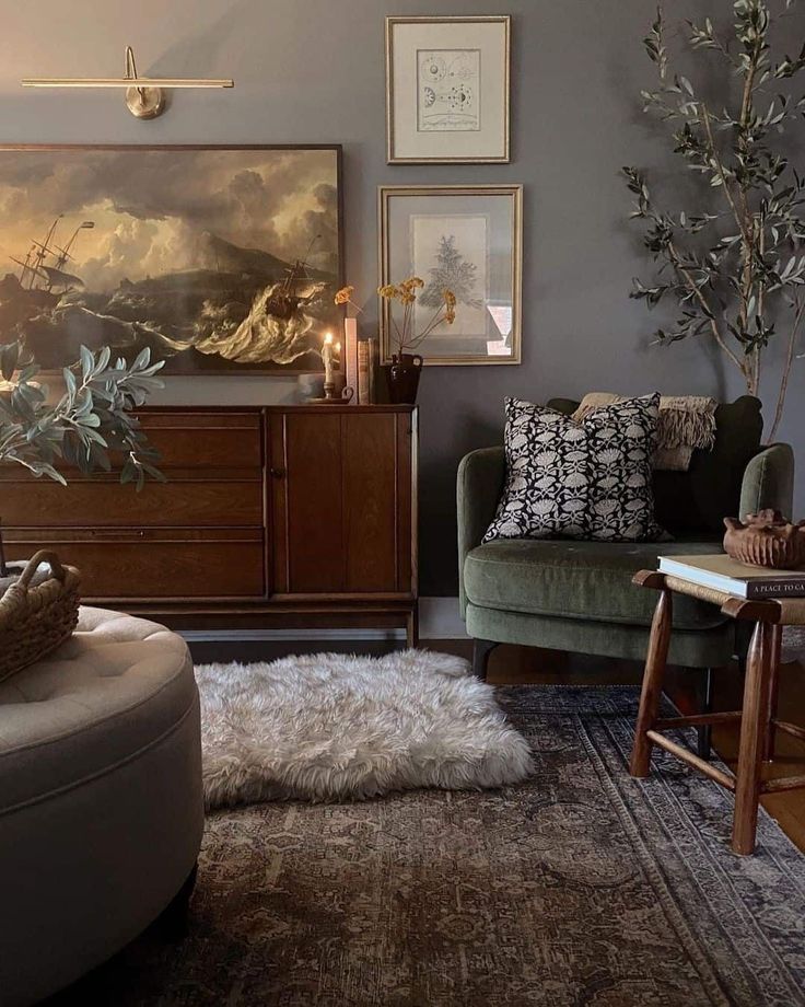 a living room filled with furniture and pictures on the wall above it's fireplace