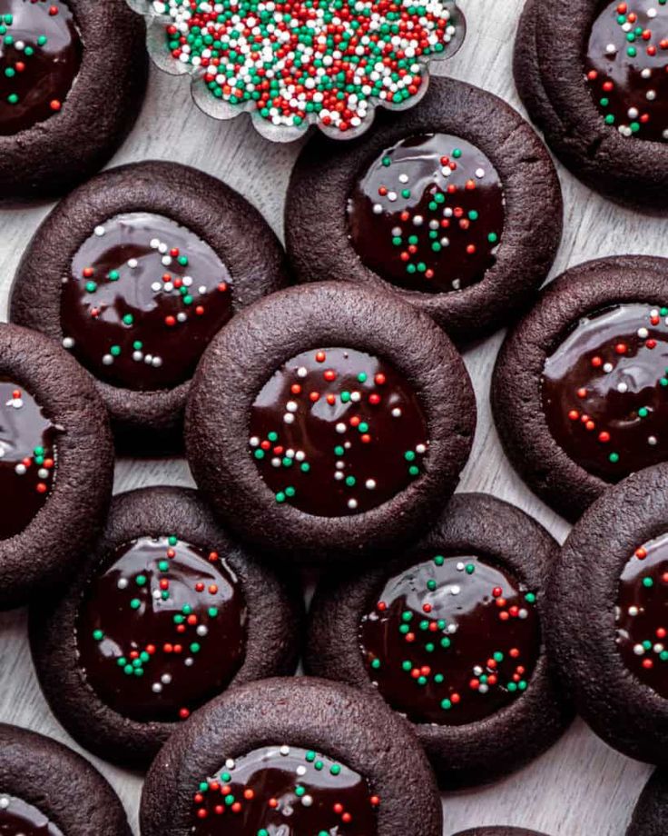 chocolate covered cookies with sprinkles on a table