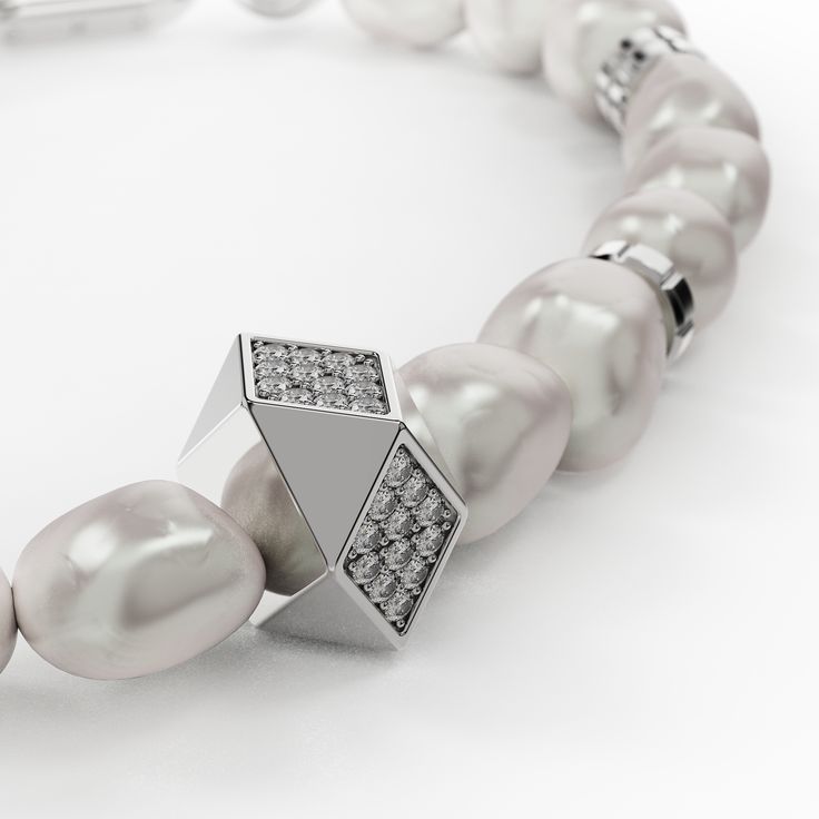 Complementing our stunning necklace, this exquisite bracelet features a harmonious blend of the finest river pearls and a custom-designed stainless steel chain. The unique design alternates between lustrous pearls and sleek steel links, mirroring the elegance of the necklace. Our logo is elegantly engraved on the chain, adding a distinctive touch of branded luxury. Available in three sizes S, M, and L the bracelet offers a perfect fit for any wrist. Wear it alone or paired with the matching neck Elegant Metal Bracelet With Pearl Chain, Elegant Metal Bracelets With Pearl Chain, Luxury White Gold Pearl Oyster Bracelet, Luxury Metal Pearl Chain Necklace, Luxury Pearl Necklace With Metal Chain, Modern Pearl Chain Jewelry, Luxury White Gold Pearl Jubilee Bracelet, Elegant Metal Pearl Necklace For Formal Occasions, Elegant Metal Pearl Necklace For Formal Events