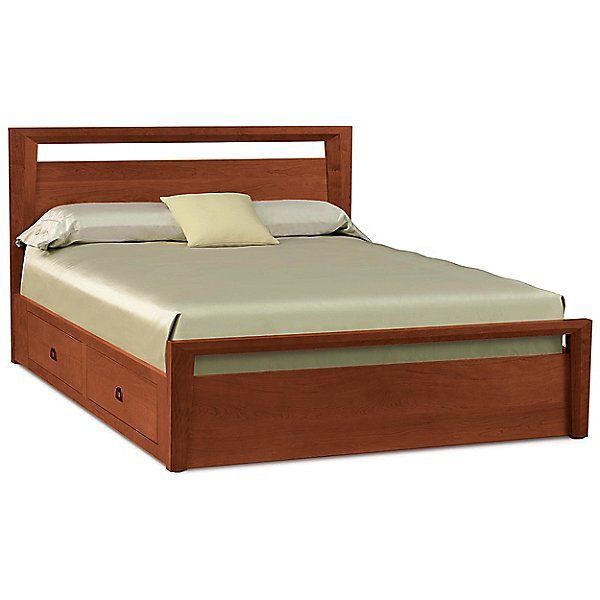 a wooden bed frame with two drawers on the bottom and one drawer under it,